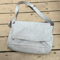 Gray shoulder bag on a wooden surface